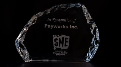 A glass statue recognizing Payworks at one of Canada’s Top Small and Medium Employers for 2024.