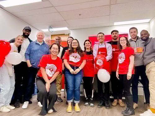 9.	A group of Payworks staff wearing matching red United Way gear.