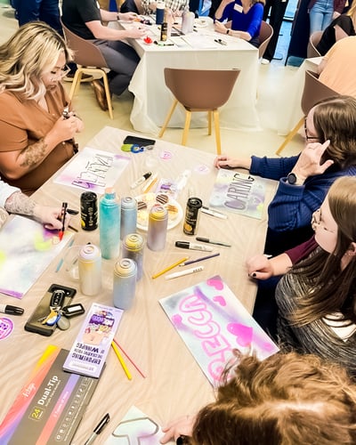 11.	Payworks staff working on graffiti art projects.