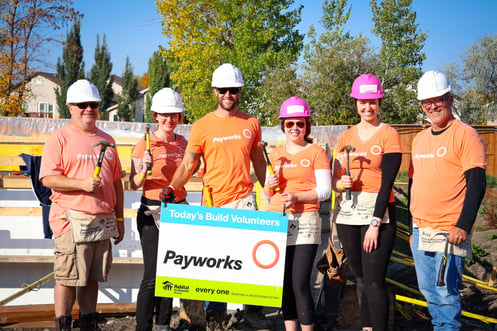 Six staff in Payworks t-shirts and hard hats.