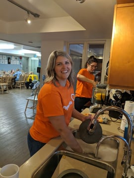 Payworks staff doing dishes.