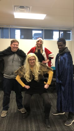 Four individuals in costumes.
