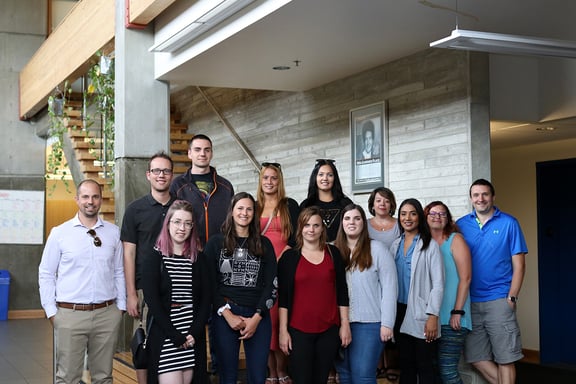 Group photo with 13 Payworks staff members.