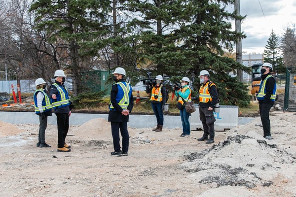 Seven individuals at a construction site.