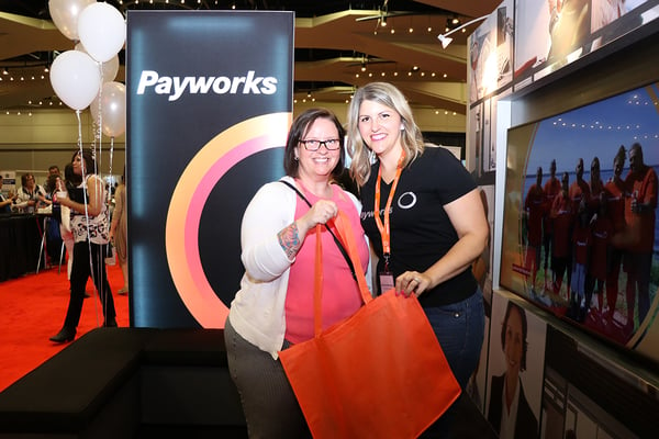Payworks staff with a prize winner.