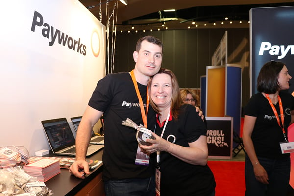 Two Payworks staff with a record cookie. 