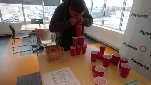 An individual playing minute to win it games.