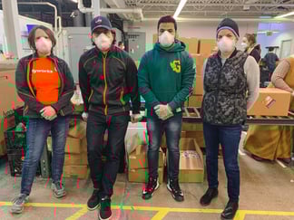Four Payworks staff at Harvest Manitoba.