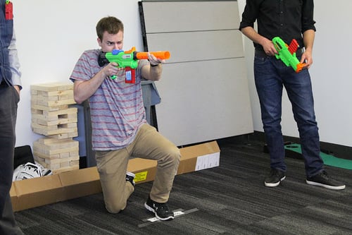 A Payworks staff with a nerf toy.