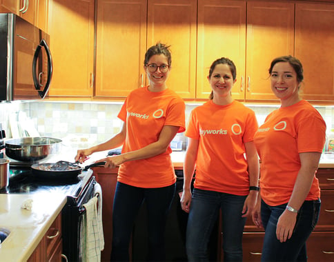 Three Payworks staff in a kitchen at RMHC. 