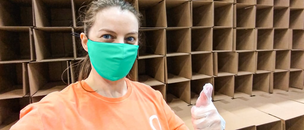 Payworks Sales Support Associate Victoria Irwin giving the thumbs up while wearing a mask.  