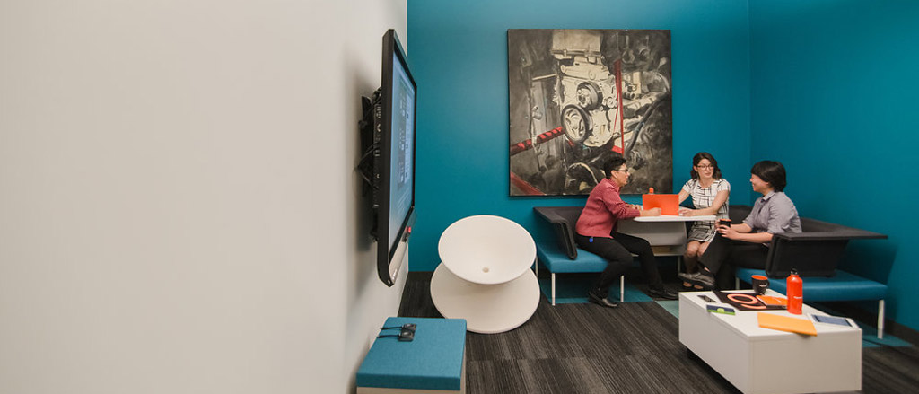 Three women sitting in a collaboration space. Text reads, “Product Spotlight; Workforce Analytics; Make timely, data-driven decisions, en français!”.  