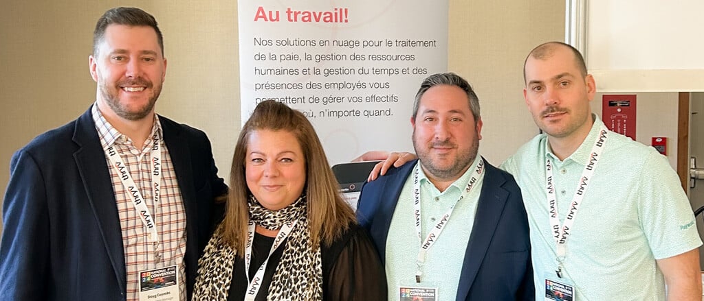 Four Payworks staff at a tradeshow accompanied by text that reads, "your map to connection...where you can find our team from East to West!".  